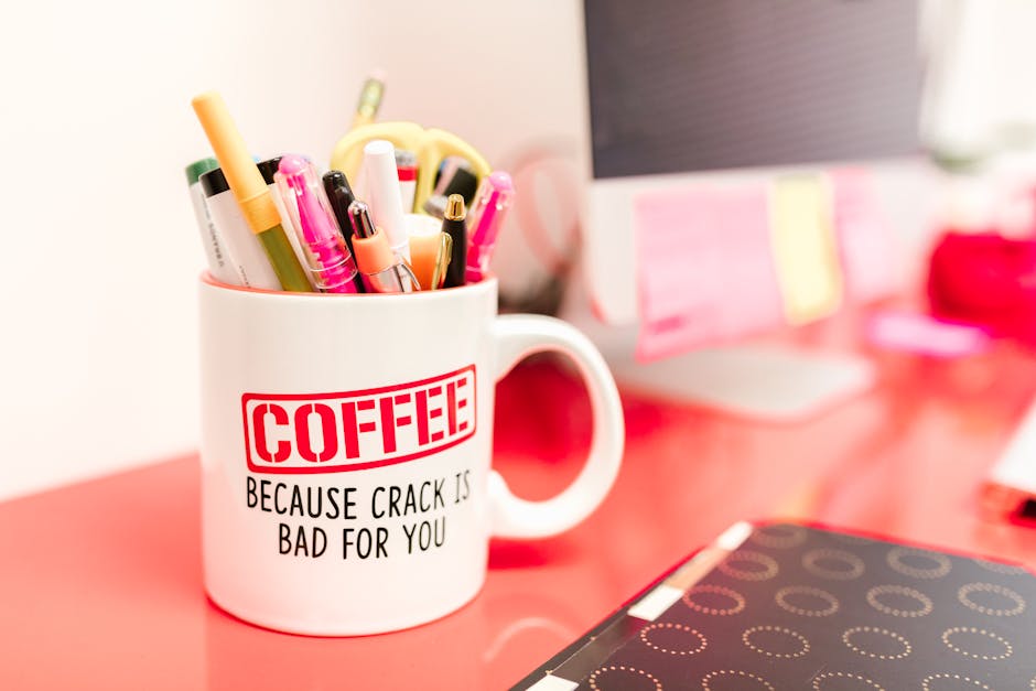 Humorous coffee mug filled with pens on a vibrant office desk, creating a quirky workspace vibe.