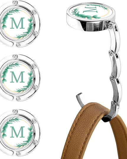 XSUIOY 3Pcs Personalized Initial Foldable Purse Hook for Table,Crushed Flower Letters Folding Purse Hanger,Purse Holder Handbag Hanger Collection Desk Table Bag Hooks Gifts for Women Bag(Green-M)