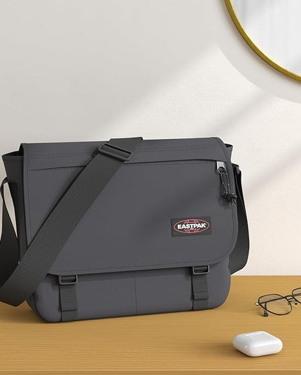 EASTPAK Delegate + – 20L Weatherproof Shoulder Bag with 17" Laptop Sleeve, Trolley Strap, Reflective Details, Adjustable Padded Strap, Black